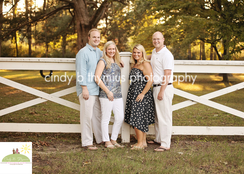 family photo by white fence collierivlle tn