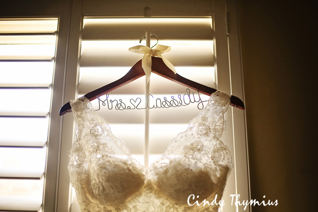 memphis wedding dress on a hanger