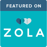 A logo of zola in blue and with two hearts on it.