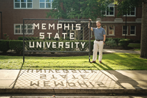 A man standing beside Memphis state university