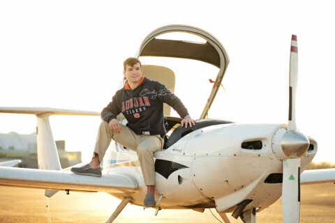 Picture of a high school senior boy on an airplane in Memphis TN